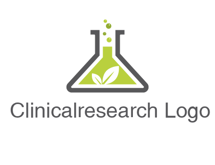 leaf with green substance bubbling in a flask