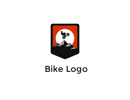 jumping bike and mountain emblem